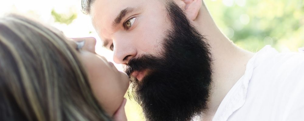 Man obsessively looking at his girlfriend