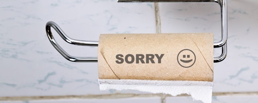 Empty toilet roll with sorry written on it